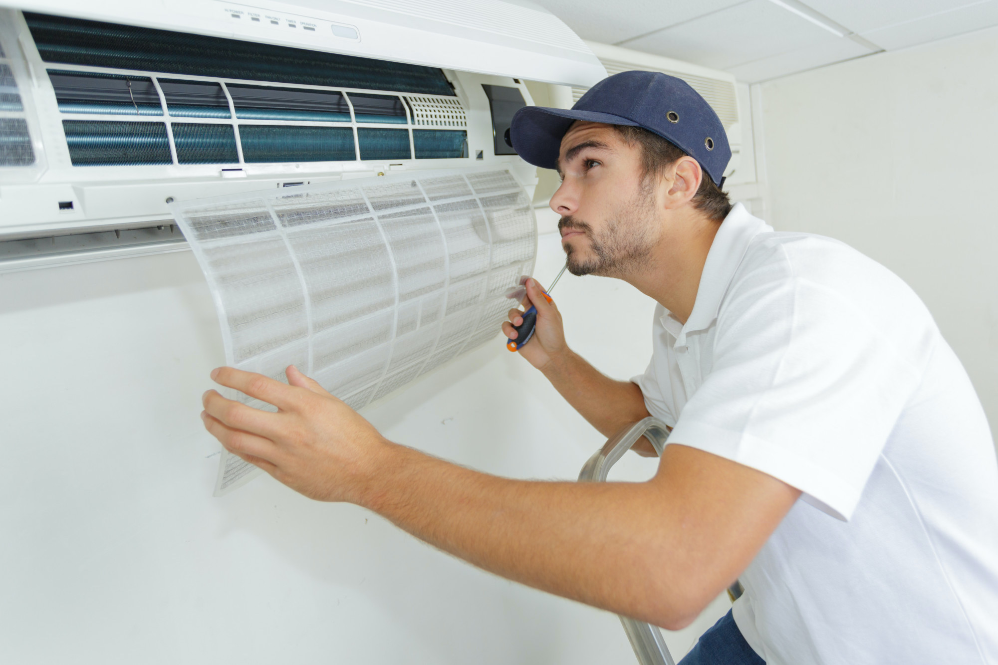 person performing an air conditioning repair