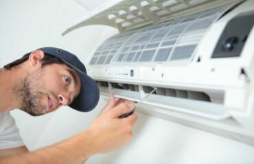 Man performing AC Repair